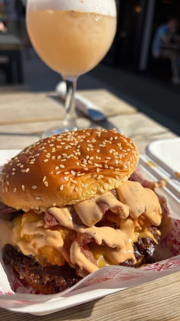 A montage-style video showcasing a street food venue in Cardiff Bay, featuring various food traders including burger, pizza, pasta, and ice cream vendors, alongside cocktails and outdoor seating.