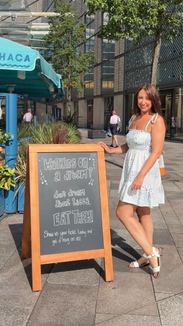 A promotional reel featuring a creator visiting a Wahaca restaurant in Cardiff. The video highlights the venue's atmosphere, various food items like tacos and quesadillas, and a specific promotion offering a free margarita to customers who present a same-day gig ticket.