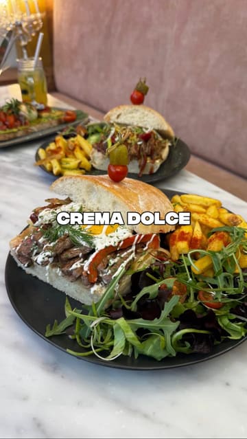 A promotional video for a cafe in Fallowfield, Manchester, showcasing their new brunch menu, including various ciabatta sandwiches, loaded fries, desserts like crepes and waffles, and coffee.