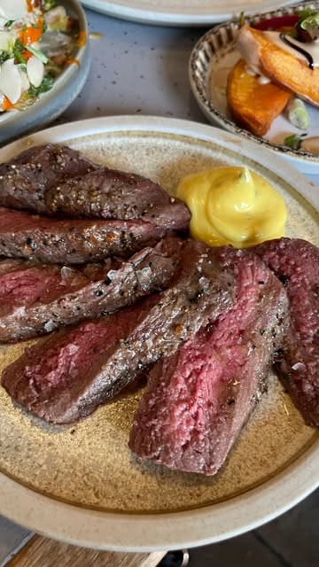 A promotional reel featuring a visit to Maray restaurant and The One O'Clock Gun, highlighting the use of the Shuffle rewards app to get cashback on the bill. The video showcases various dishes, drinks, and the app's interface.
