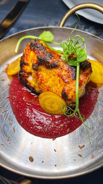 A high-quality montage showcasing the interior, cocktails, and a variety of Indian dishes at Vatavaran London. The video focuses on the presentation of the food and the ambiance of the venue.