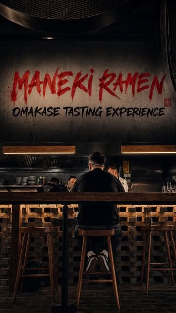 A moody, atmospheric shot of a diner at a counter during an omakase tasting experience at Maneki Ramen, emphasizing the venue's intimate and exclusive vibe.