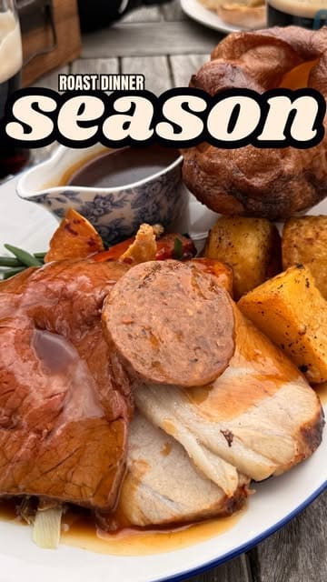 The video features a creator reviewing a pub called The White Hart in Cadnam, highlighting its suitability for a roast dinner in a pub garden setting. It includes shots of the exterior, the garden, the menu, and the food.
