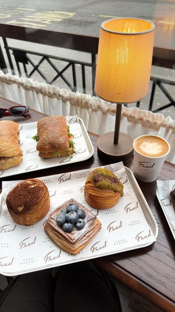 A short, engaging reel showcasing a variety of pastries and sandwiches at Fred Bakery. The video features close-up shots of the food, including a tiramisu croissant, and brief glimpses of the bakery's interior, set to music with text overlays.
