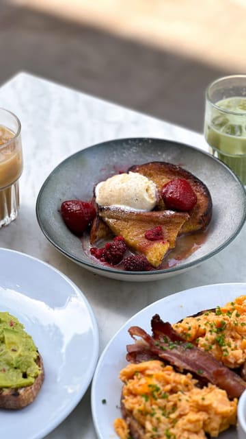 A short, aesthetic reel showcasing a brunch visit to Minnow in Clapham, featuring shots of the exterior, interior, iced drinks, avocado toast, and French toast.