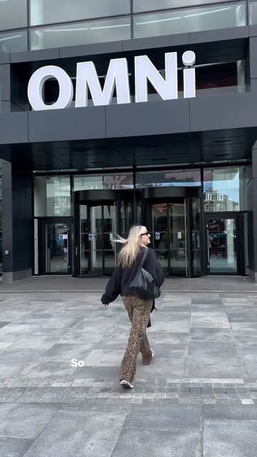 A vlog-style video featuring a creator visiting the newly refurbished Omni Centre in Edinburgh, showcasing the event atmosphere, the Vue cinema, and dining at Edinburgh Street Food.