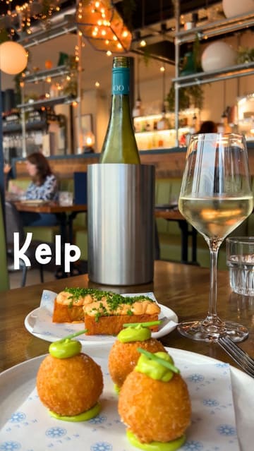 A polished montage showcasing a variety of seafood-focused small plates, cocktails, and the interior of Kelp restaurant in Glasgow. The video focuses on high-quality close-ups of the food and drink presentation, creating an inviting and upscale atmosphere.