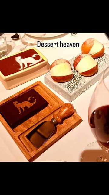 A montage video showcasing the interior, menu, and various dishes at an Italian restaurant in Mayfair, including pizza, burrata, fish, chicken, and desserts.