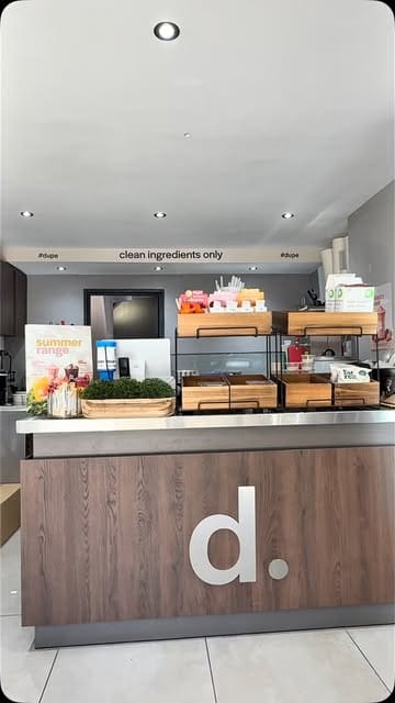 A review of an açai bowl shop called 'dupe.' in Leicester, featuring shots of the venue's interior and close-ups of the açai bowls being reviewed.
