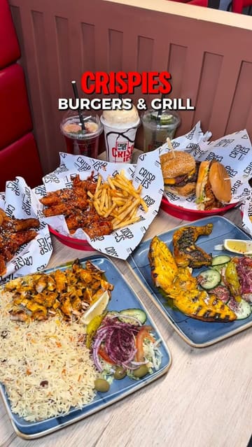 A fast-paced montage showcasing the menu at Crispies Burgers & Grill, featuring close-ups of burgers, wings, grilled chicken, rice dishes, and drinks, interspersed with shots of the restaurant interior.