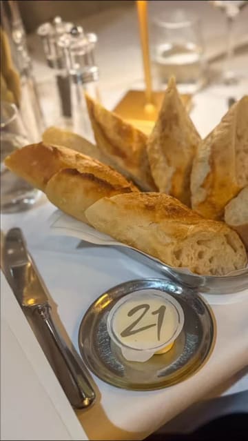 A short, edited montage of dishes served at 21 in Newcastle, featuring close-ups of a cheese soufflé, pumpkin soup, flat iron steak, and desserts being prepared or served.