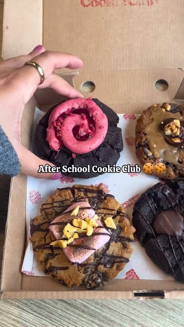 A short, energetic video showcasing a visit to After School Cookie Club, highlighting their plant-based, large, filled cookies and matcha latte.