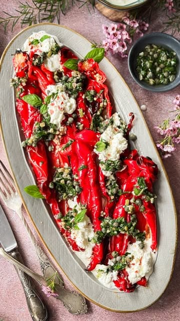A high-quality, aesthetically pleasing recipe tutorial for roasted pointed peppers with homemade stracciatella and olive dressing, filmed with clear, top-down instructional shots.
