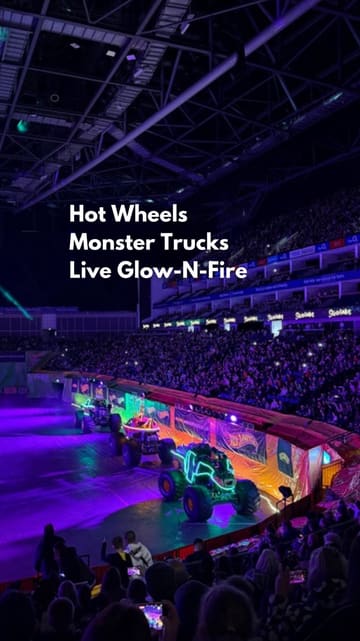 A compilation of clips from the Hot Wheels Monster Trucks Live Glow-N-Fire show at The O2, featuring monster trucks performing stunts, light shows, and crowd reactions.