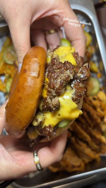 A short, punchy montage showcasing various menu items from a burger spot, including smash burgers, Nashville chicken sandwiches, loaded fries with mac and cheese, and Korean-style wings.