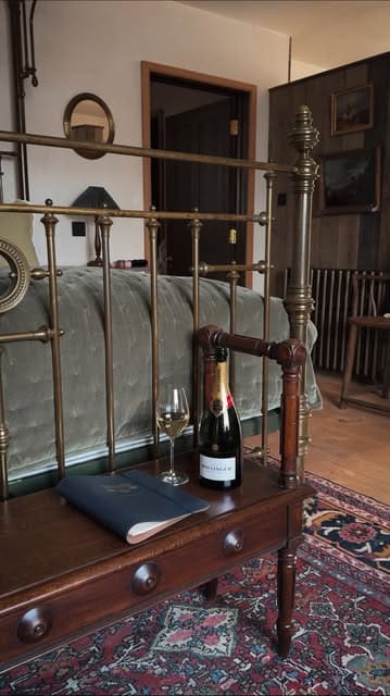 A cinematic montage showcasing a luxury countryside getaway at Ashcombe Estate, featuring outdoor dining, champagne, and estate amenities like wild swimming and a wood-fired sauna.