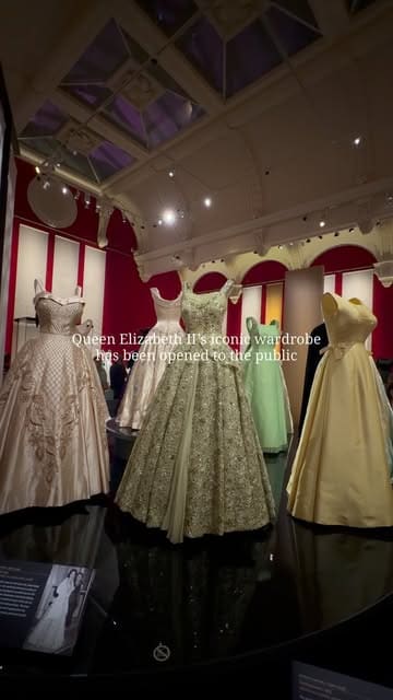 A montage of shots showcasing the Queen Elizabeth II: Her Life in Style exhibition at The King's Gallery, Buckingham Palace, featuring various outfits, hats, and accessories worn by the late monarch.