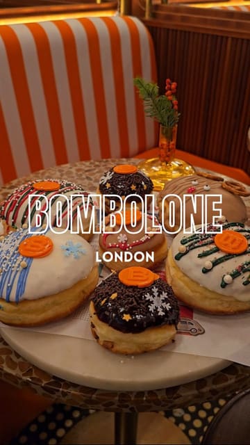 A short, punchy montage showcasing the interior, exterior, and various food and drink items at Bombolone, including doughnuts, sandwiches, and coffee.