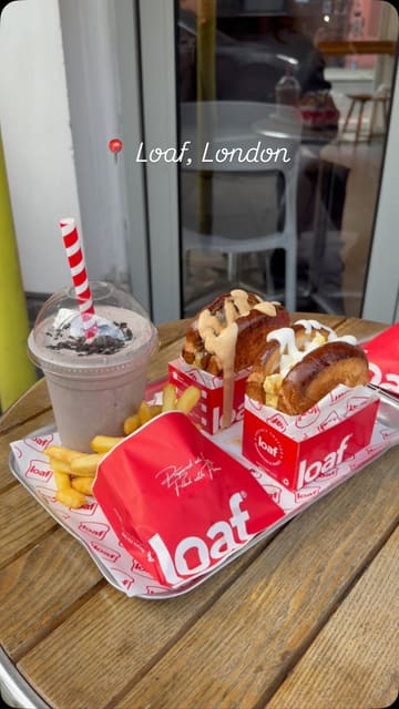 A short promotional video for Loaf, featuring shots of the storefront, the interior, and a tray of food including smash burgers, fries, and milkshakes.