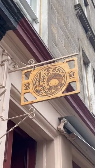 A video review of Pomelo in Edinburgh, featuring the creator's visit to try the spring menu. The video includes shots of the restaurant exterior, the cosy interior, the menu, and several dishes including banchan, salad, prawn toast, and noodles.