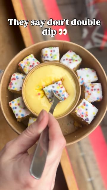 A creator visits The Cuppie Hut to try their new 'Double Dipper' hot pots, which feature a selection of cake bites served with a central pot of custard for dipping.