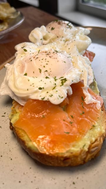 A short, authentic vlog-style video showcasing Lock 7 Coffee, a canal-side cafe in Castlecroft. The video highlights the breakfast and lunch menu, including coffee, tea, an omelette, and avocado toast with salmon, while emphasizing the peaceful atmosphere and scenic canal views.