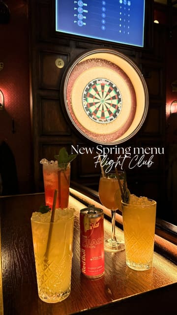 A short, upbeat reel showcasing a visit to Flight Club Darts. The video features clips of friends playing darts, enjoying a variety of new cocktails, and sharing a spread of food including nachos, tacos, sliders, and pizza. The editing is fast-paced and captures the lively social vibe of the venue.