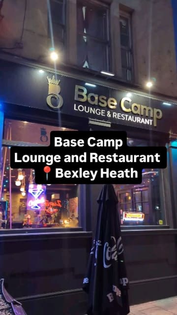 A review of Base Camp Lounge and Restaurant, highlighting its vibrant interior design featuring graffiti and flower walls, as well as its menu of Nepalese and Indian dishes and creative cocktails.