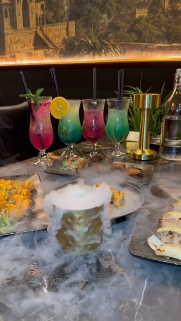 A promotional video for Indara restaurant in Rochdale, featuring a montage of the interior decor and a variety of dishes including appetizers, mains, desserts, and mocktails.