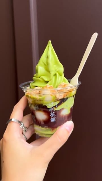 A short, engaging reel showcasing a visit to Tsujiri, a matcha and dessert shop. The video features the exterior, the menu, the preparation of matcha drinks, and close-ups of the final products, including a matcha soft serve and a shiratama sundae.