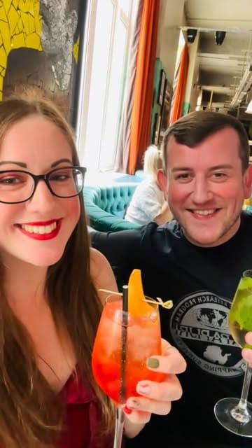 A vlog-style review of a football-themed bottomless brunch at Black Cat Club, featuring a unique card-based drink ordering system, food, and a bingo game.