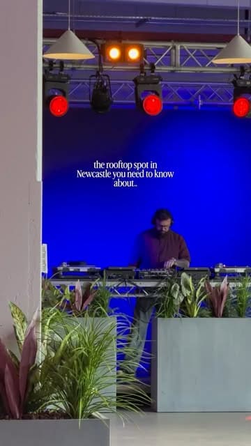 A montage video showcasing a rooftop venue in Newcastle, featuring various food dishes like tacos, nachos, arancini, and meatballs, alongside cocktails and a lively atmosphere with a DJ.