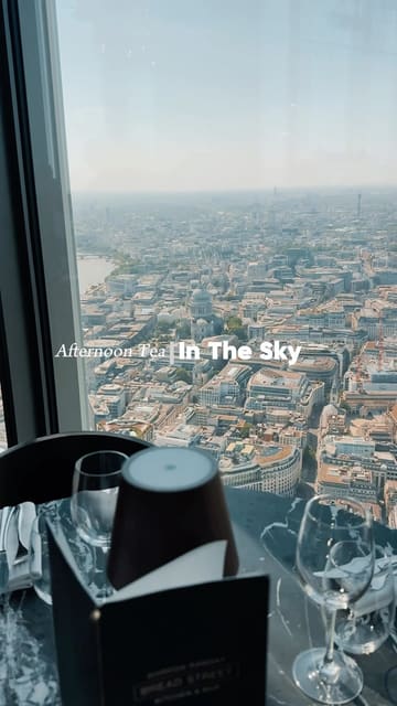 A montage showcasing an afternoon tea experience at Bread Street Kitchen, highlighting the panoramic London skyline views, the table setting, and the food presentation.