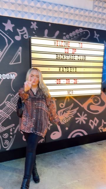 A vlog-style tour of the Co-op Backstage Club at Co-op Live, showcasing the amenities available to concert-goers, including food, drinks, games, a photo booth, and exclusive merchandise.