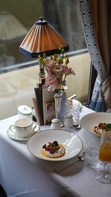 A cinematic showcase of a luxury train journey on the Belmond British Pullman, featuring fine dining, scenic views, and elegant interiors.