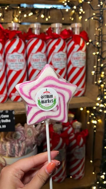 A creator visits the German Christmas Market at Meadowcroft Garden Centre, showcasing the festive atmosphere, various stalls, food, and activities like curling.