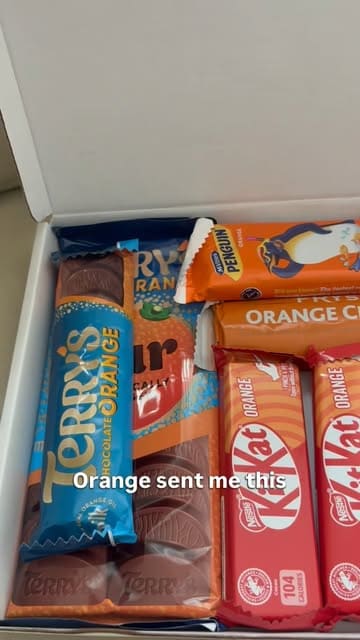 A creator unboxes a 'Terry's Chocolate Orange' themed treat box and uses the contents to bake a chocolate orange banana bread at home.