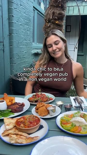 A short montage showcasing a variety of vegan dishes at a pub, including starters, mains, and desserts.