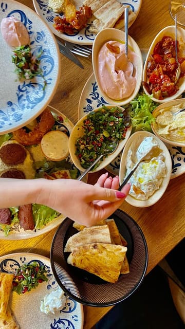 A video showcasing a visit to Ephesus Meze & Grill, featuring a variety of Turkish dishes including cold and hot meze platters, a mixed grill, and desserts.