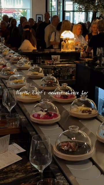A short, stylish video showcasing the interior and unique cheese conveyor belt system at Blacks Corner in Sunderland, featuring close-ups of cheese plates, wine, and the venue's upscale atmosphere.