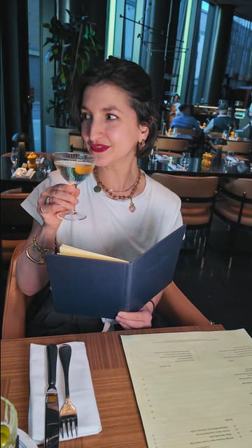 A promotional video for a restaurant and bar in Shoreditch, highlighting their £8 happy hour cocktails and a variety of dishes including salmon crudo, truffle flatbread, halibut, rib-eye, and desserts.