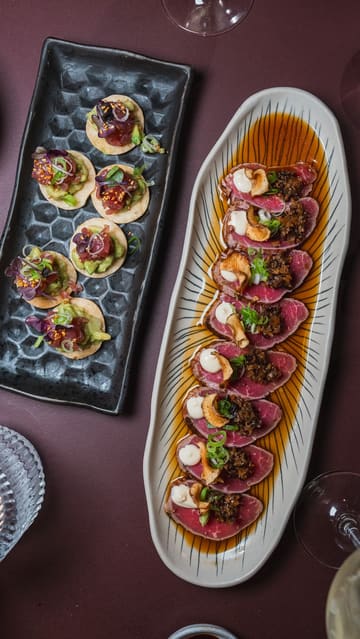 A short, engaging video featuring a visit to Sticks'n'Sushi in London. The creator showcases a variety of dishes including beef tataki, tuna tartare, and a DIY hand roll set, highlighting the interactive and high-quality nature of the food.