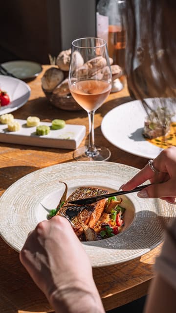This reel provides a behind-the-scenes look at a professional food photoshoot at Bokan London. It alternates between shots of the photographer setting up the scene and the resulting high-quality images of dishes like steak, salmon, and a cheese board, all set against a backdrop of the London skyline.