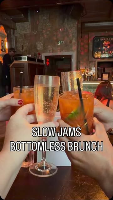 A fast-paced, energetic video showcasing a bottomless brunch experience at The Old Queens Head. The footage features a group of friends enjoying pizza, cocktails, and prosecco, while dancing and singing in a lively, party-like atmosphere. The video also highlights the venue's photo booth, emphasizing the fun, uninhibited nature of the event.