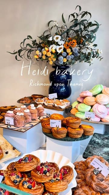A short, aesthetic reel showcasing the food selection at Heidi Bakery in Richmond. The video features close-ups of various pastries, including cruffins and croissants, as well as sandwiches and cakes, highlighting the textures and fillings.