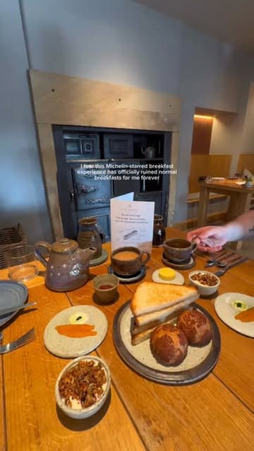 A short, visually appealing video showcasing a Michelin-starred breakfast experience at The Angel at Hetton, featuring close-ups of high-quality breakfast dishes and the cozy interior of the venue.