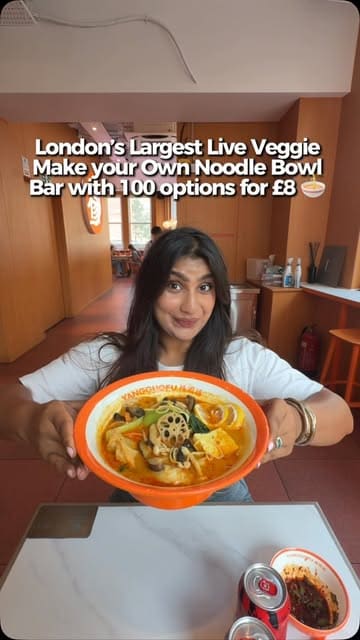A creator visits Yangguofu Malatang in Central London, demonstrating the process of building a custom noodle bowl from a wide selection of fresh vegetables, tofu, and noodles, followed by the weighing and cooking process.