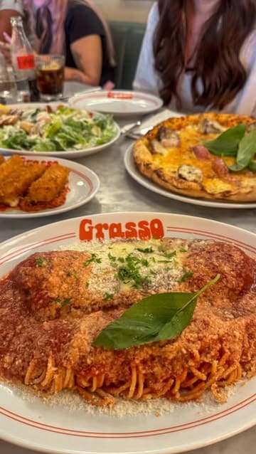 A montage of various Italian dishes including spaghetti, pizza, and tiramisu, followed by a birthday celebration at Grasso in Soho, London.