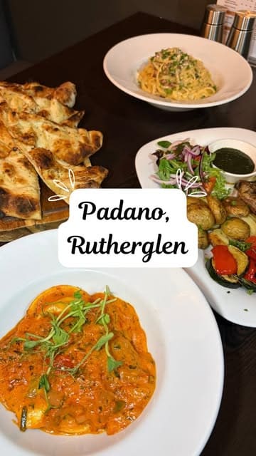 A review-style video showcasing the new menu at Padano restaurant, featuring close-up shots of various dishes including meatballs, prawns, lobster ravioli, lamb chops, and desserts like tiramisu and strawberry cheesecake.