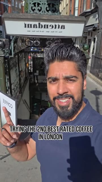 A creator visits Attendant coffee shop in London, highlighting its unique underground setting and reviewing their cappuccino.